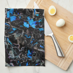 Abstract looking bat wings over stained turquoise tea towel