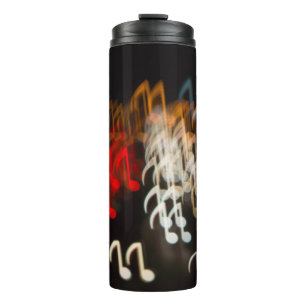 Abstract music notes: lights bokeh background thermal tumbler