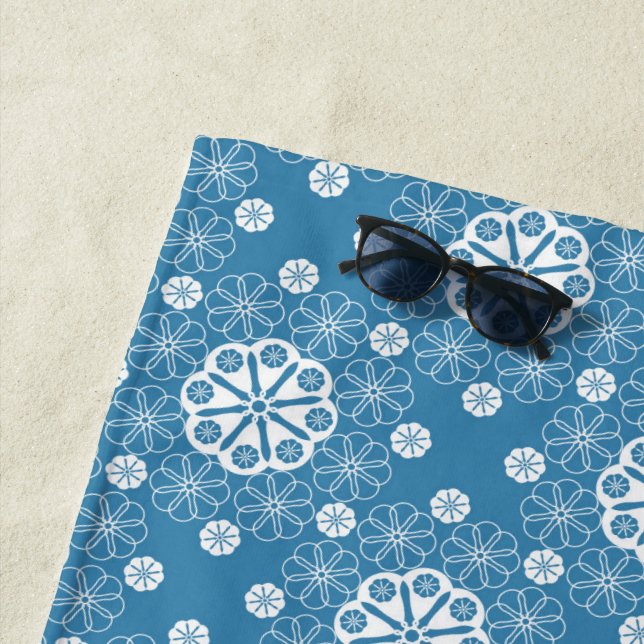 Abstract openwork floral pattern in light blue col beach towel (In Situ)