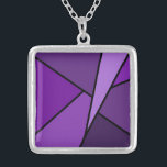 Abstract Purple Polygons Silver Plated Necklace<br><div class="desc">Inspired by stained glass, this stylish geometric design contains polygons in various shades of purple outlined in black. A lavender triangle slashes in from the upper right with an array of progressively darker purple quadrangles and other shapes spiralling around it from light to dark. Two dark purple shapes ground the...</div>