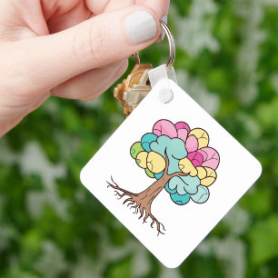 Abstract tree with roots and colourful leaves. key ring