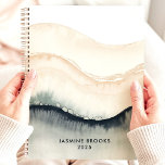 Abstract Watercolor Waves 2025 Custom Name Planner<br><div class="desc">Dive into a sea of tranquillity with this calming planner. Abstract watercolor waves in soothing shades of blue, grey, and beige create a serene backdrop for your dreams and aspirations. Imagine yourself jotting down your thoughts and appointments amidst this tranquil flow. Personalise it with your name and let this planner...</div>