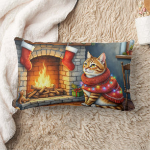 Abyssinian Cat Sitting by Fireplace with Christmas Lumbar Cushion