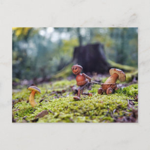 Acorn elf carrying a mushroom in a little cart postcard