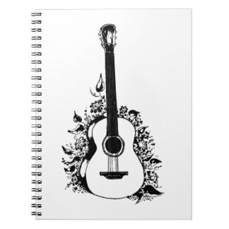 Acoustic guitar on a background of flowers.  sleev notebook