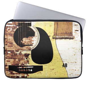 acoustic guitar on brick collage laptop sleeve