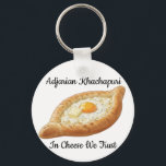 Adjarian Khachapuri  Key Ring<br><div class="desc">Adjarian Khachapuri is a traditional Georgian dish from the region of Adjara, located along the Black Sea coast of Georgia. It is a boat-shaped bread made from soft yeast dough, filled with melted cheese, and topped with a fresh egg yolk and a slice of butter. Before eating, the egg and...</div>