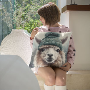 Adorable alpaca wearing blue beanie cushion