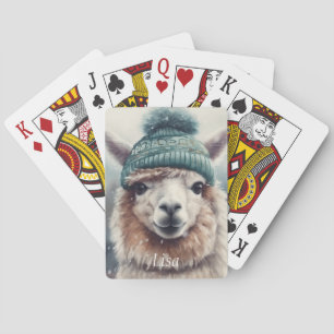 Adorable alpaca wearing blue beanie  playing cards