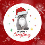 Adorable and Cute Santa Kitten Meowy Christmas Classic Round Sticker<br><div class="desc">This cute and adorable Meowy Christmas kitten will be the perfect design to have on your stickers. The design features an adorable grey kitten with black frame glasses, full beard and moustache along with a Santa Claus hat. The background has red, green and gold stars and/or snowflakes. Perfect for cat...</div>