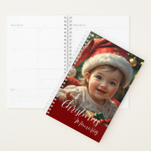 Adorable Baby in Santa Outfit with Christmas Planner