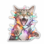 Adorable Cat in Christmas Tree Lights Holiday<br><div class="desc">Bring a touch of whimsy and festive cheer to your holiday decorations with our unique Cat Christmas Lights Holiday Sticker! This charming sticker features an adorable cat tangled up in Christmas tree lights, capturing the playful spirit of the season. Perfect for adding a personal touch to your gifts, scrapbooks, or...</div>
