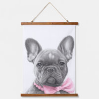 Adorable french bulldog puppy with a pink bow