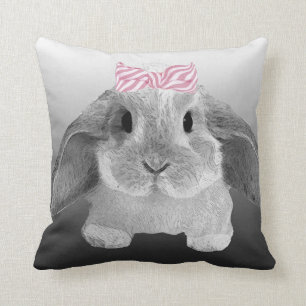 Adorable little bunny with a pink bow cushion