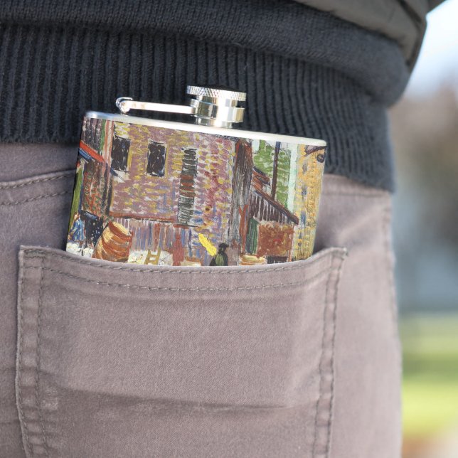 Adorable playful fluffy cute kitten in the city hip flask (In Situ)