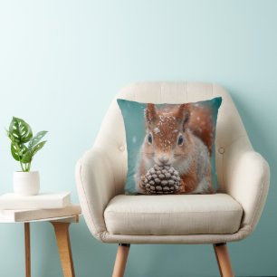 Adorable Red Squirrel in the Snow with a Pinecone Cushion