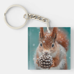Adorable Red Squirrel in the Snow with a Pinecone Key Ring