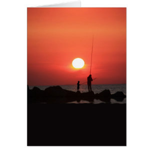 Adult and Child Fishing at Sunset