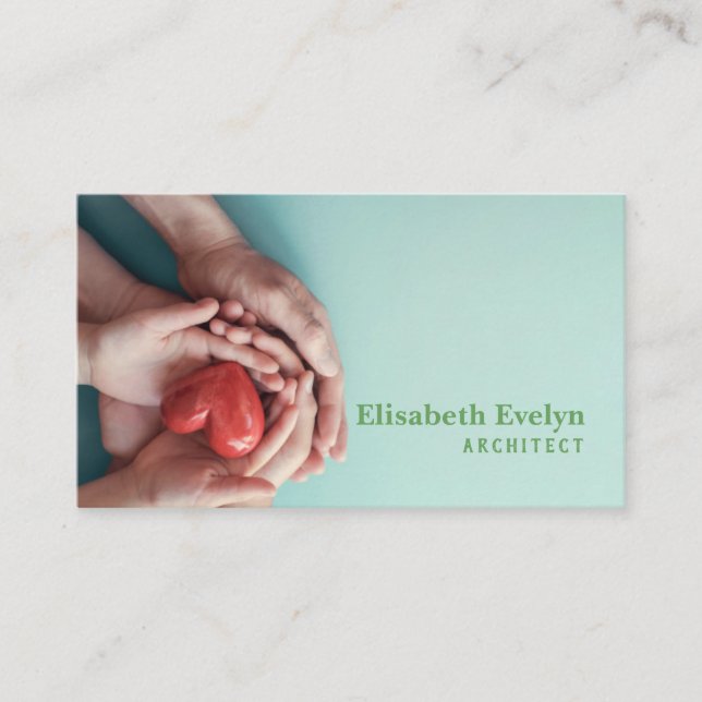 Adult and child hands holding red heart on aqua business card (Front)