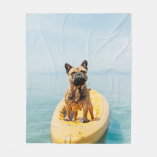 Adult brown French bulldog standing on kayak Fleece Blanket