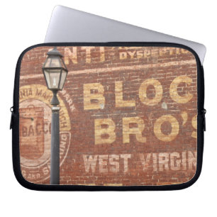 Advertisements on side of building laptop sleeve
