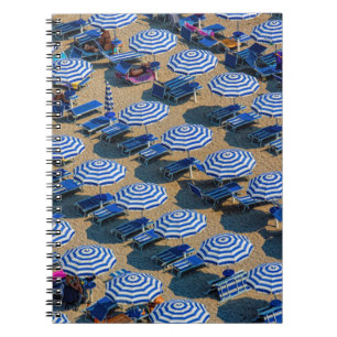 AERIAL PHOTOGRAPHY OF BLUE-AND-WHITE PATIO UMBRELL NOTEBOOK