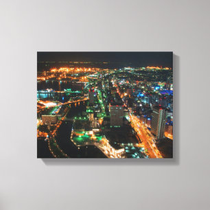 aerial photography of city buildings at night time canvas print