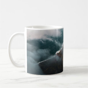 AERIAL PHOTOGRAPHY OF MOUNTAIN COVERED WITH FOG COFFEE MUG