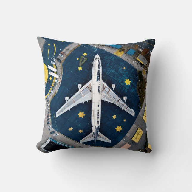 AERIAL PHOTOGRAPHY OF WHITE AND BLACK AIR LINER ON CUSHION (Front)