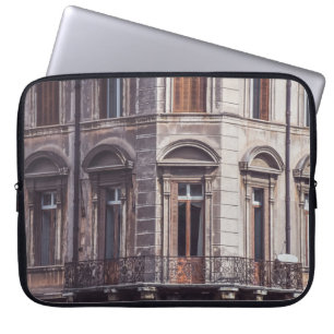 AERIAL PHOTOGRAPHY OF WINDOWPANE OF THE BUIDLING LAPTOP SLEEVE