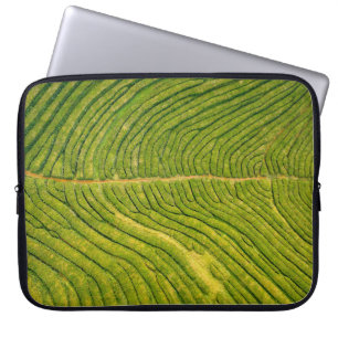 Aerial view of green open field laptop sleeve