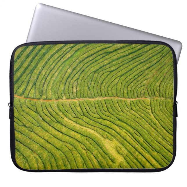 Aerial view of green open field laptop sleeve (Front)