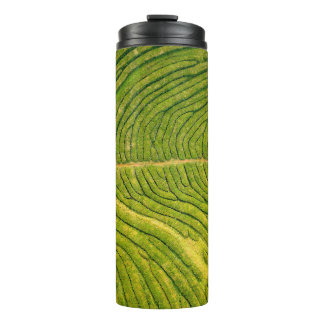 Aerial view of green open field thermal tumbler