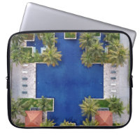 Aerial view of pool surrounded by palm trees