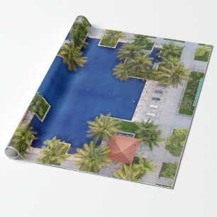 Aerial view of pool surrounded by palm trees wrapping paper