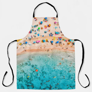 Aerial view of sandy beach with colourful umbrella apron