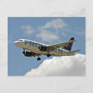 Aeroplane coming out of clouds and roar through sk postcard