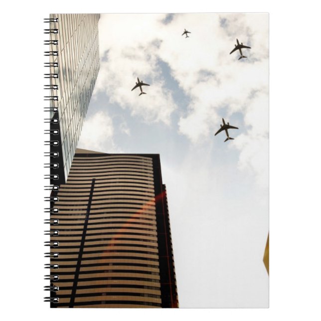Aeroplanes flying over buildings spiral notebook (Front)
