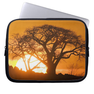 Africa, Botswana, Setting sun silhouettes Baobab Laptop Sleeve