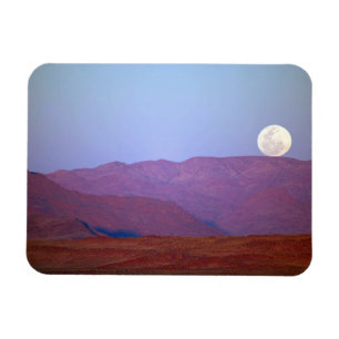 Africa, Namibia, Sossusvlei. A full moon rests Magnet