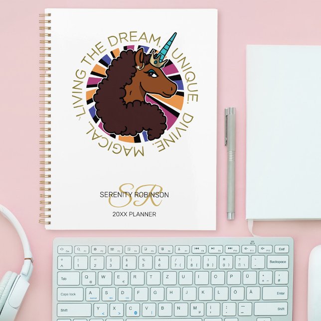 Afro Unicorn Living the Dream Design Planner (Planner on table)