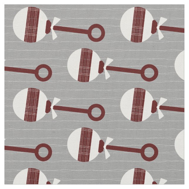 Aggie Maroon Plaid Baby Rattle on Grey Fabric (Close Up)