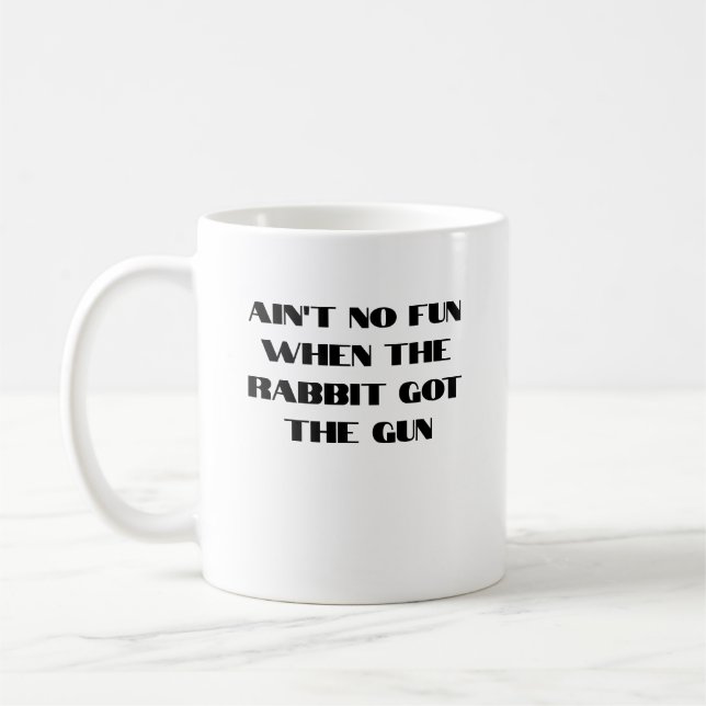 Ain't No Fun When the Rabbit Got the Gun Coffee Mug (Left)