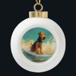 Airedale Beach Surfing Painting  Ceramic Ball Christmas Ornament<br><div class="desc">Immerse yourself in the playful world of canine adventure with this captivating painting. A spirited dog takes to the waves, skilfully riding the surf on a sun-kissed beach. The vibrant artwork beautifully captures the essence of beachside excitement as the dog fearlessly rides the waves, embodying the spirit of fun and...</div>