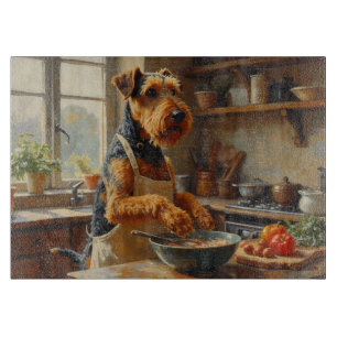 Airedale Terrier Cooking in Kitchen Cutting Board