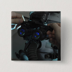 Airman adjusts the eyespan 15 cm square badge