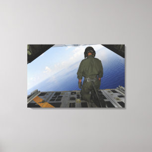 Airman observes the waters of the Gulf of Mexic Canvas Print