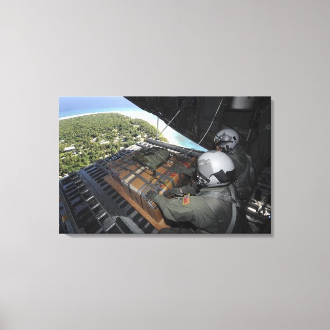 Airmen push out a pallet of donated goods 2 canvas print (Front)