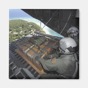 Airmen push out a pallet of donated goods 2 magnet