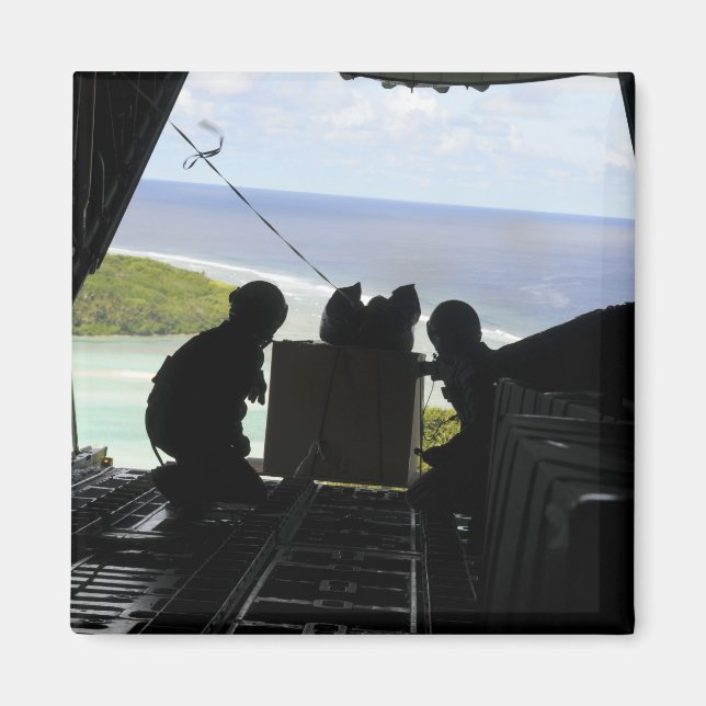 Airmen push out a pallet of donated goods magnet (Front)